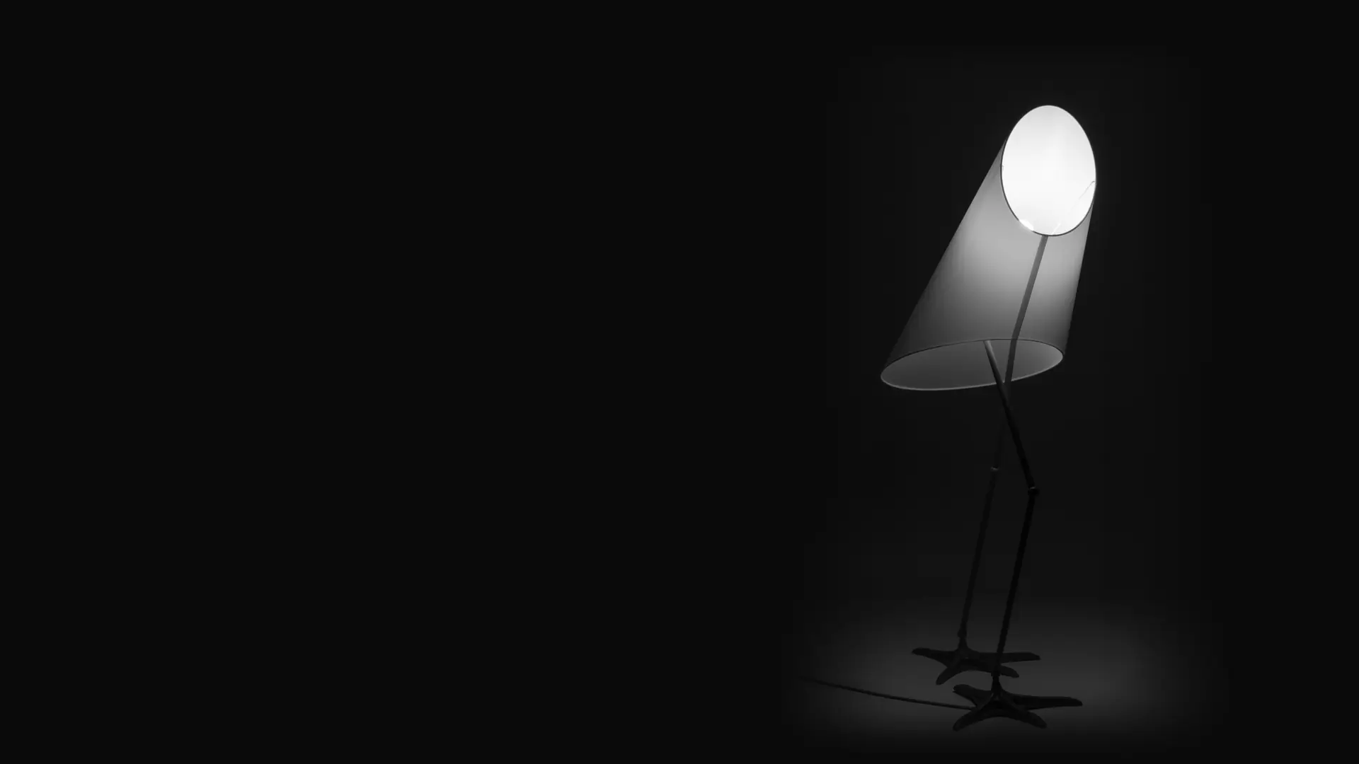 Lampa podłogowa STORK na stalowych nogach, zapalona w ciemnym wnętrzu